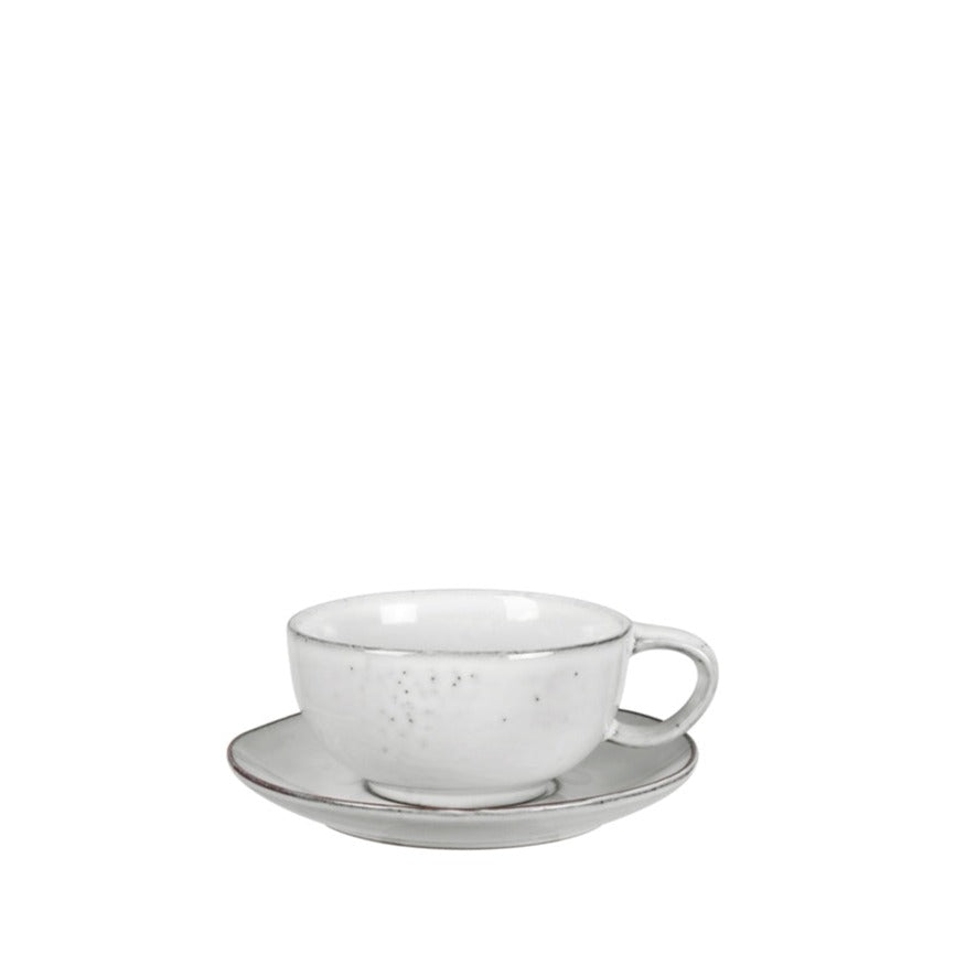 Off white speckle glazed cappuccino cup and saucer set.