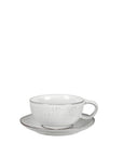 Off white speckle glazed cappuccino cup and saucer set.