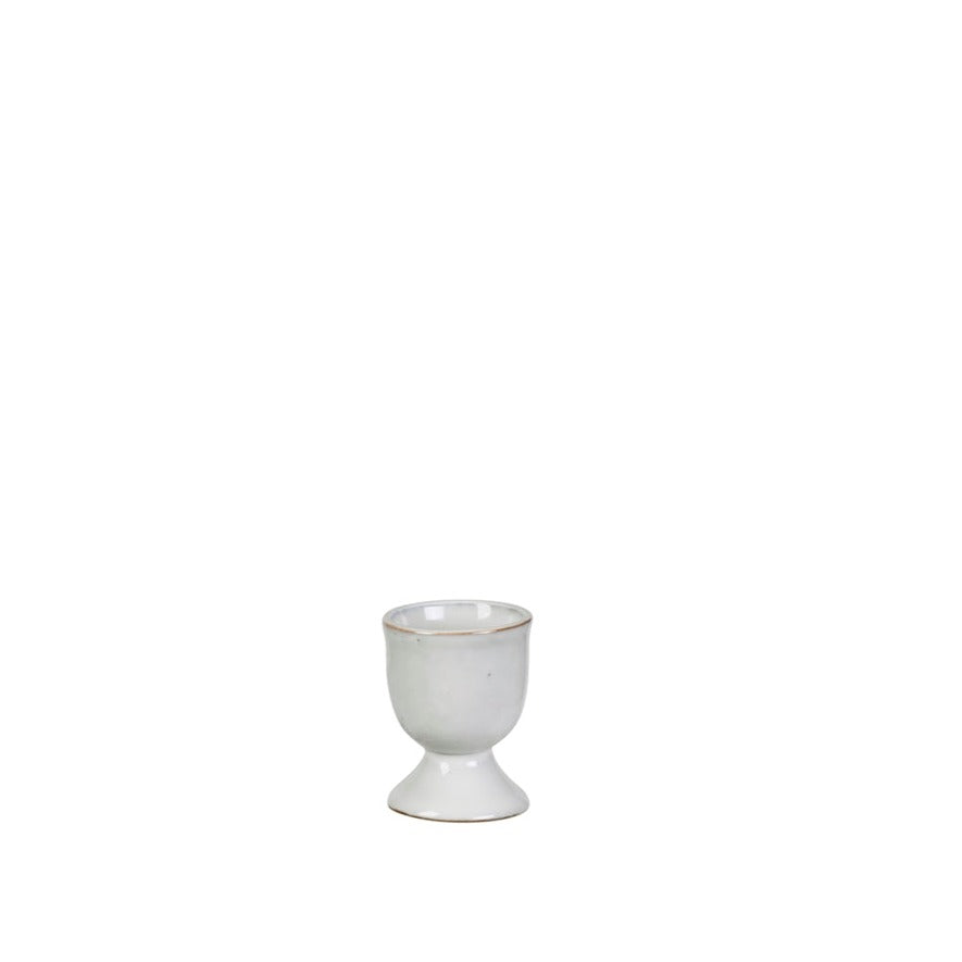Off white speckle glazed egg cup.