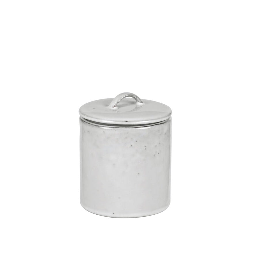 Off white speckle glazed jar with lid.