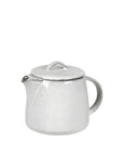 Off white speckle glazed tea pot from spout view.