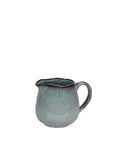 Blue glazed milk jug with handle.