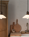 Ceramic and antique brass pendant lights.