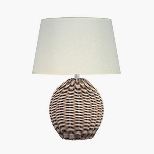 Rattan circular woven small table lamp with cream shade.