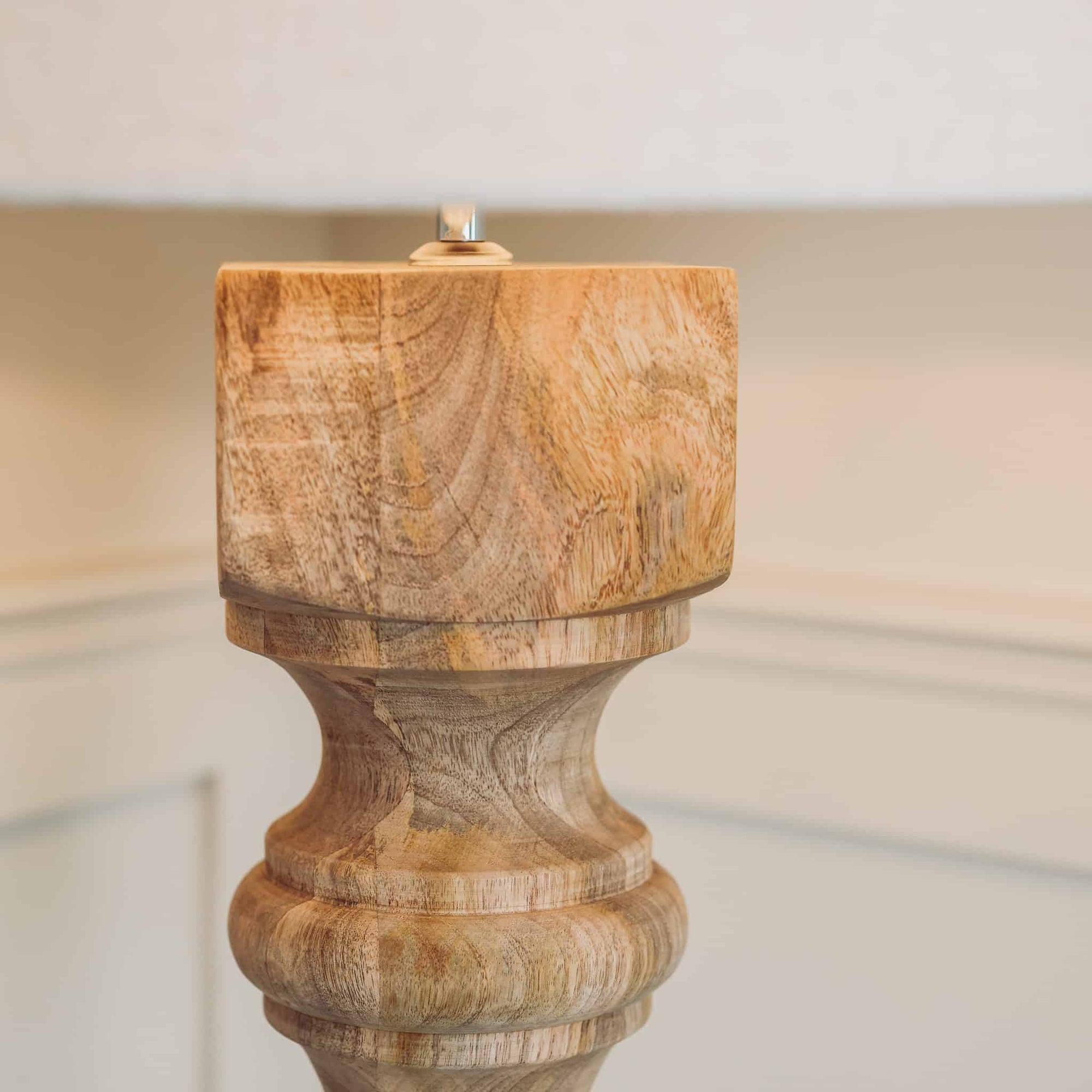 Close up of wooden lamp base with natural grain.