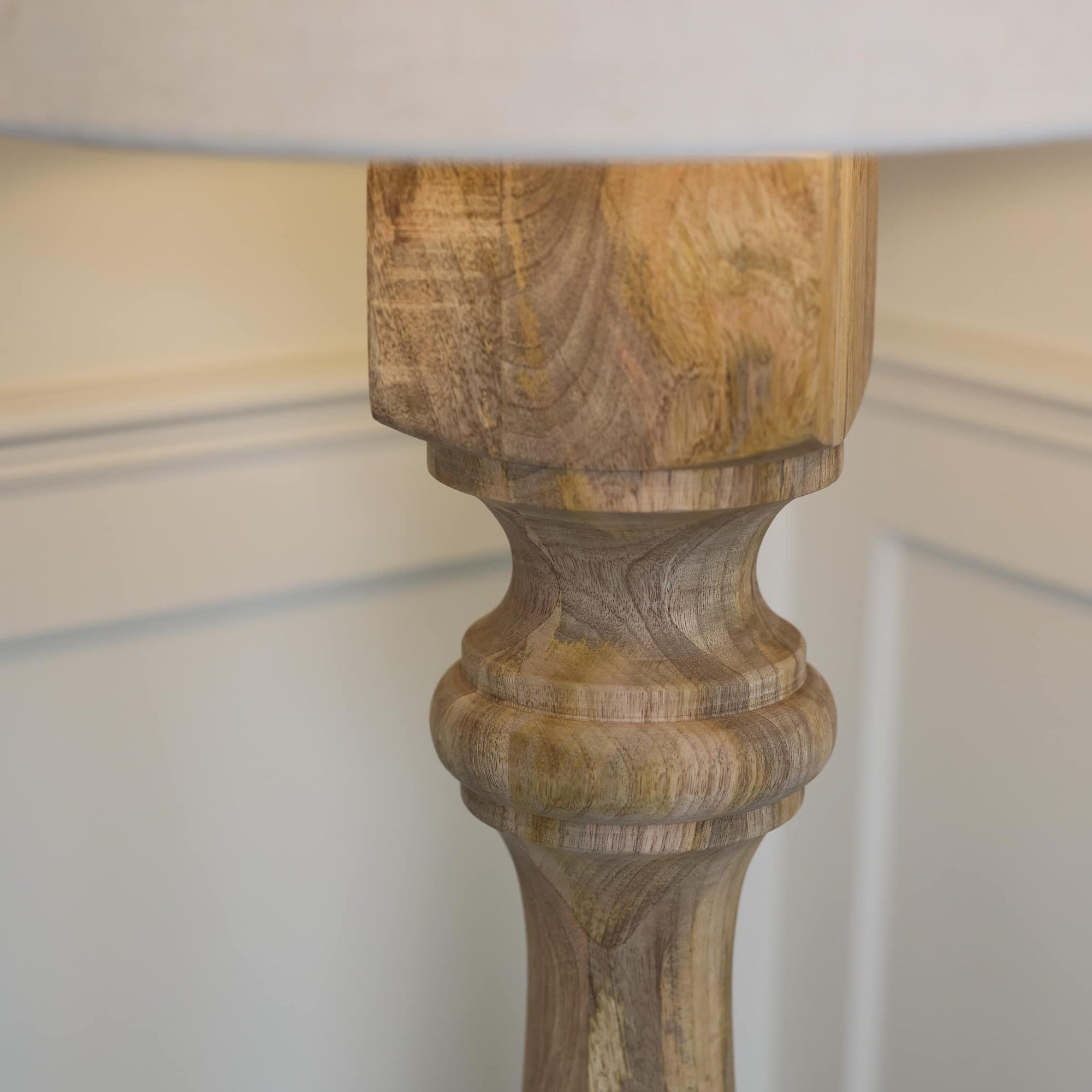 Close up of wooden grain on lamp base.