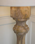 Close up of wooden grain on lamp base.