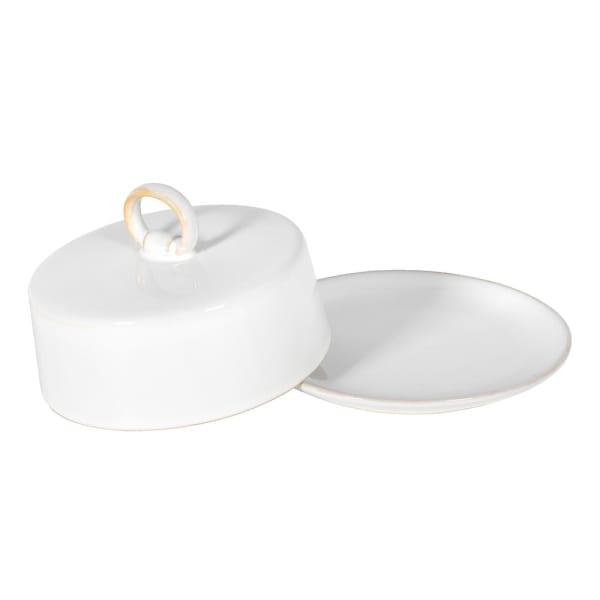 Off white circular butter dish with lid slightly off.