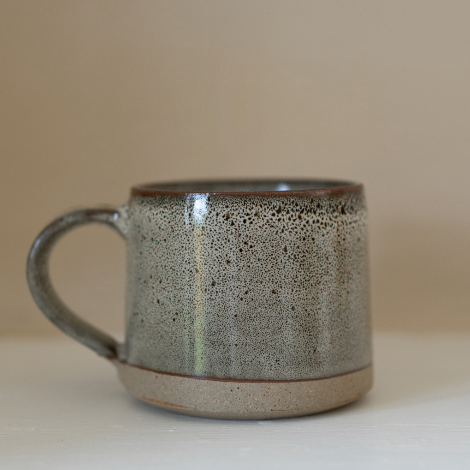 A brown speckled stoneware mug.