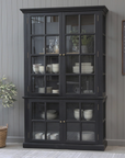 Black Armoire displaying crockery.