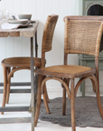 wicker dining chairs at table. 