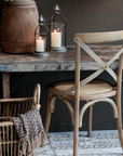 Rustic Dining chair and table with candles.