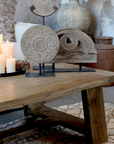 rustic wooden coffee table with decor items and candles.