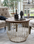 rustic white coffee table with wooden lid and decor items.