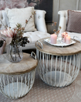 rustic coffee tables set with pink decor items,