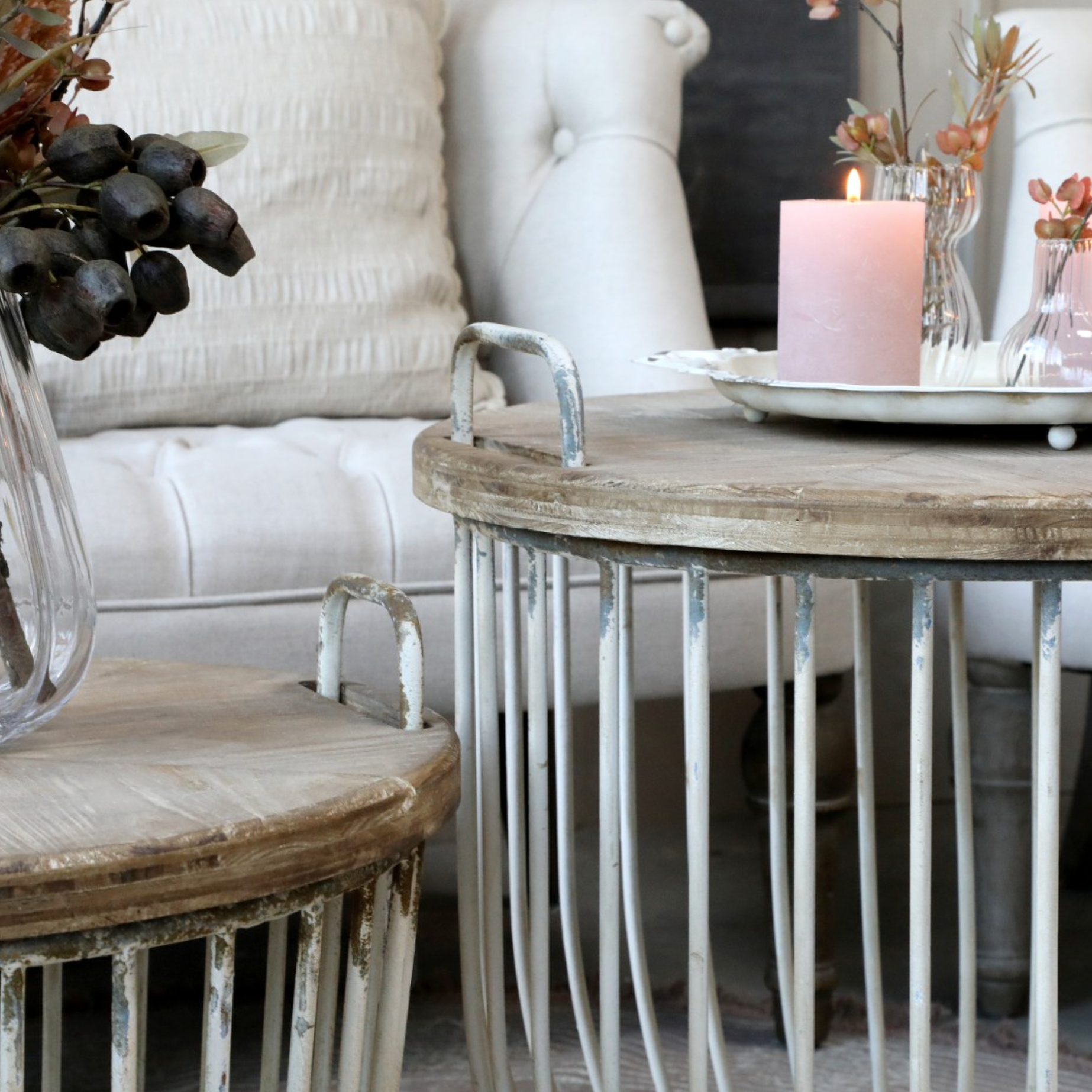 a close up of our rustic coffee tables set with pink decor.