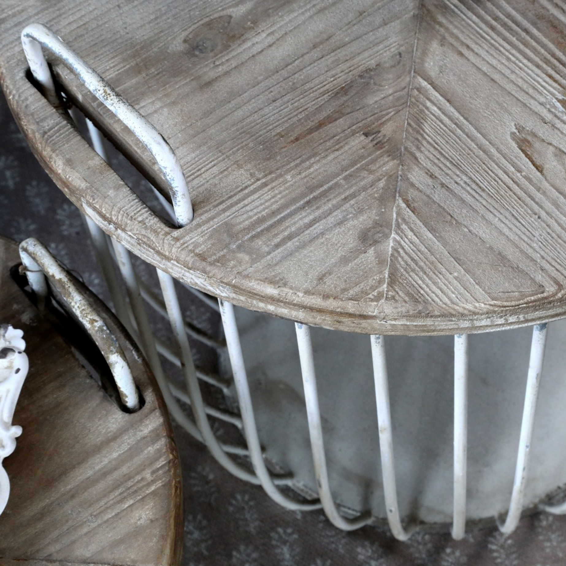 chunky wooden lid on a rustic coffee table with antique white finish.