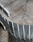 chunky wooden lid on a rustic coffee table with antique white finish.