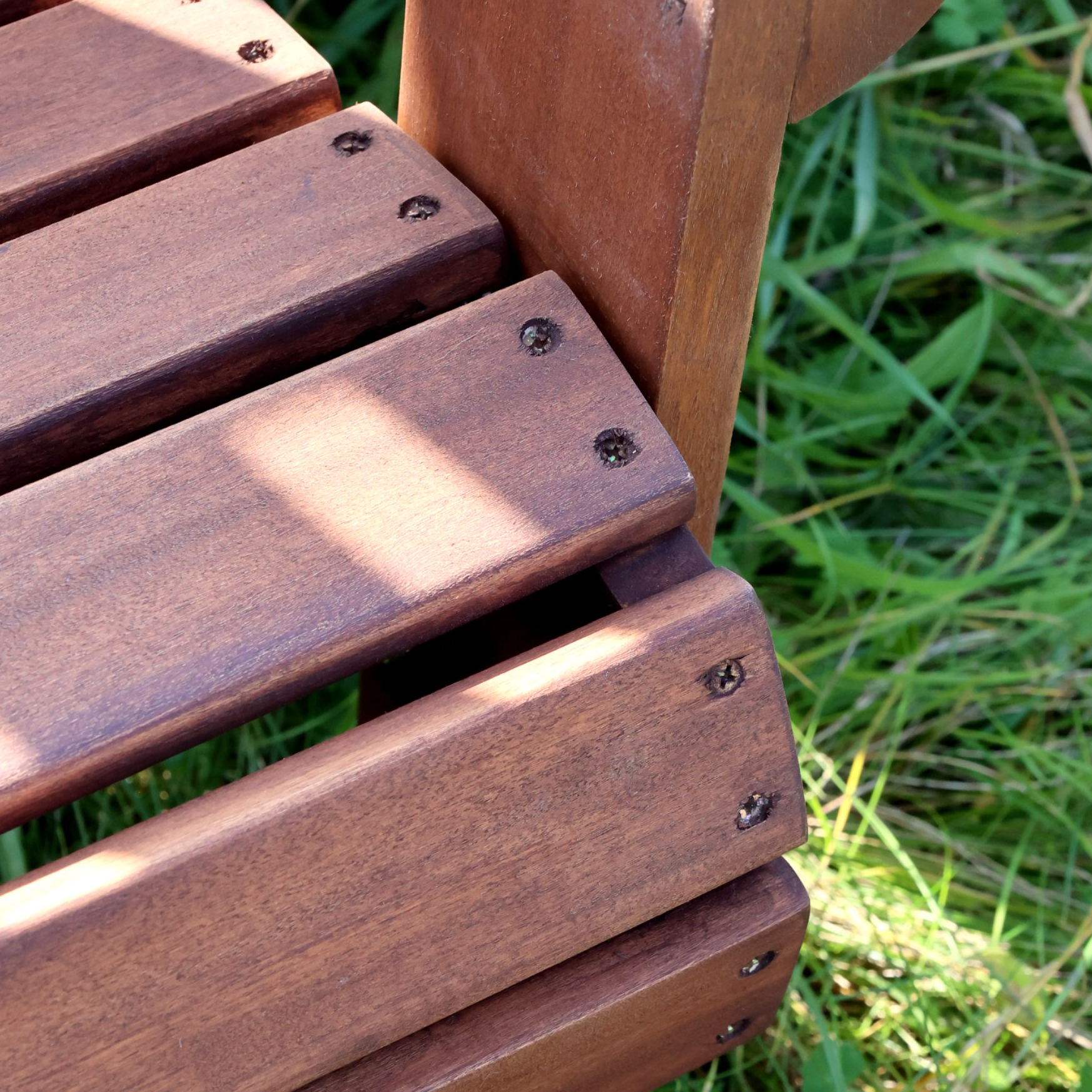 detailed shot of outdoor wooden armchair. 