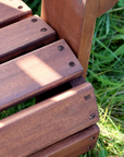 detailed shot of outdoor wooden armchair. 