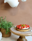 Wooden Cake Stand with strawberry tart.