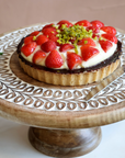 Wooden Cake Stand with strawberry tart.