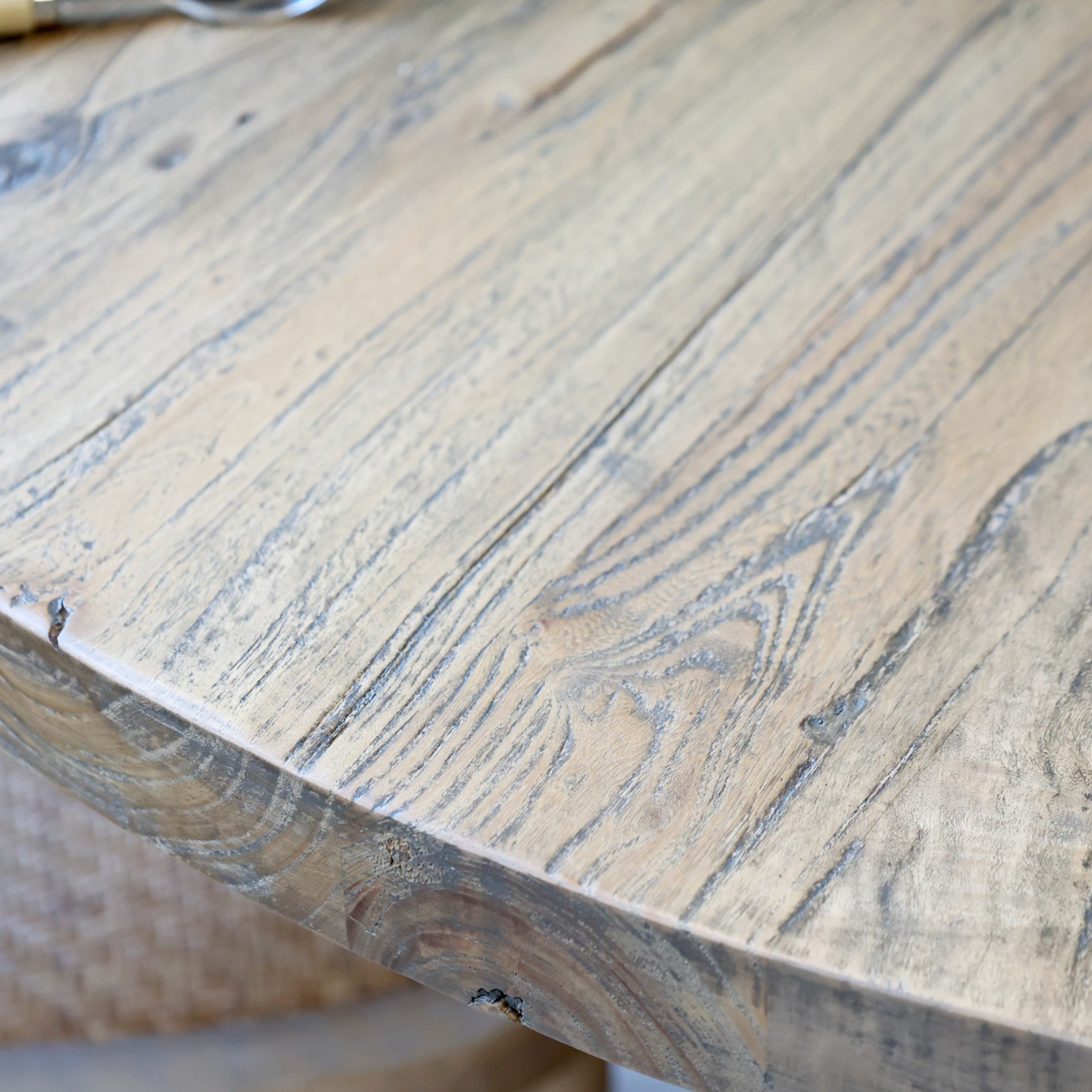 A detailed shot of the Round wood dining table.