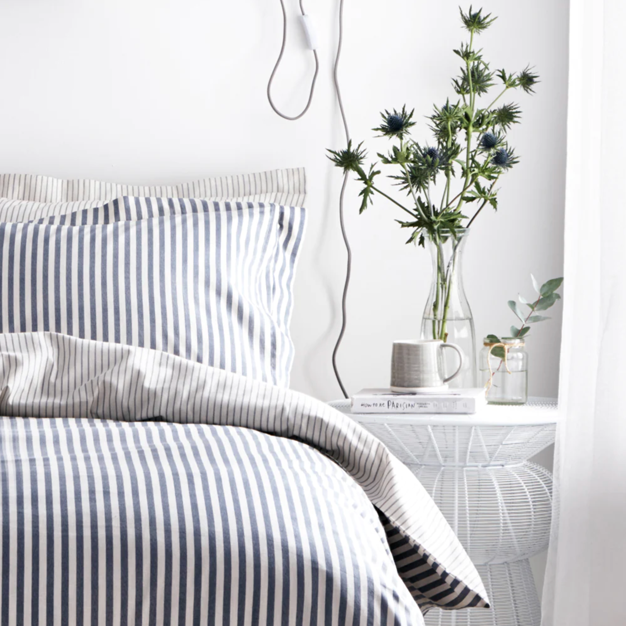 Navy Blue Bedding Set with plant.