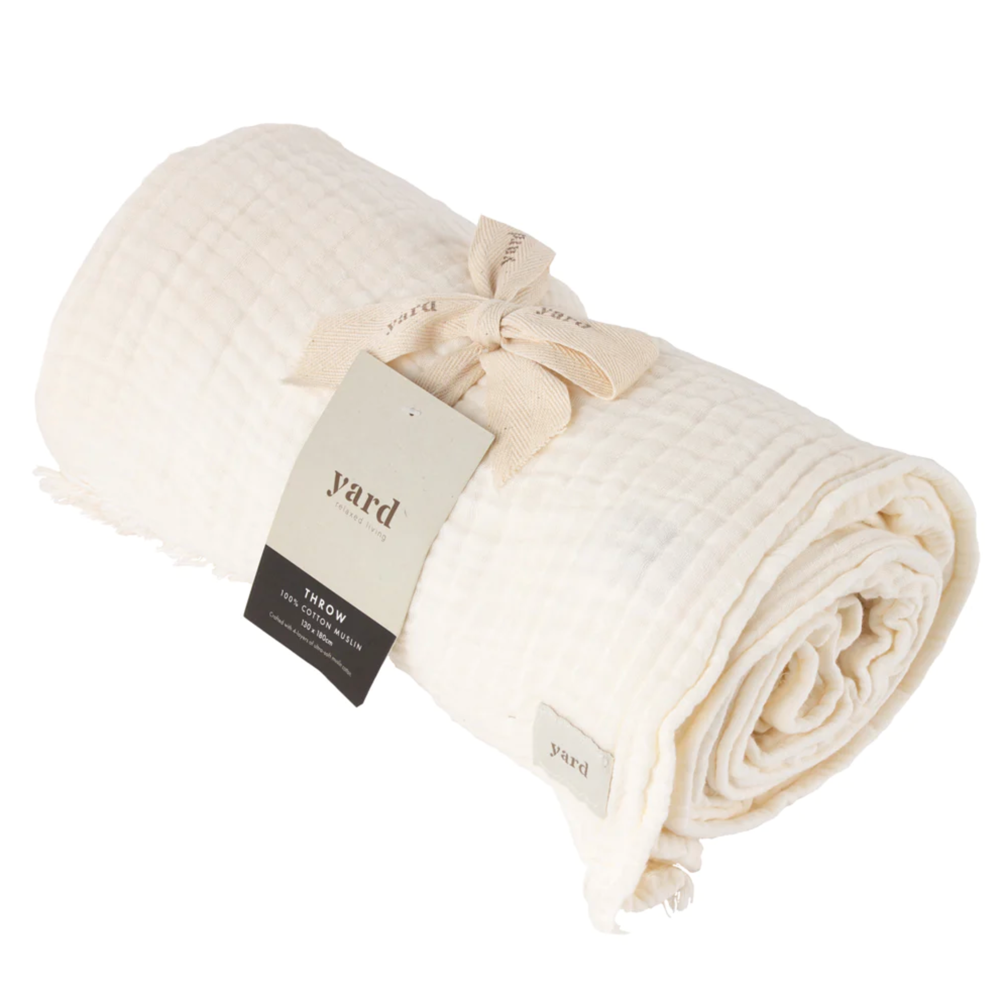 White Muslin Bedspread rolled up and tied neatly with cotton ribbon.