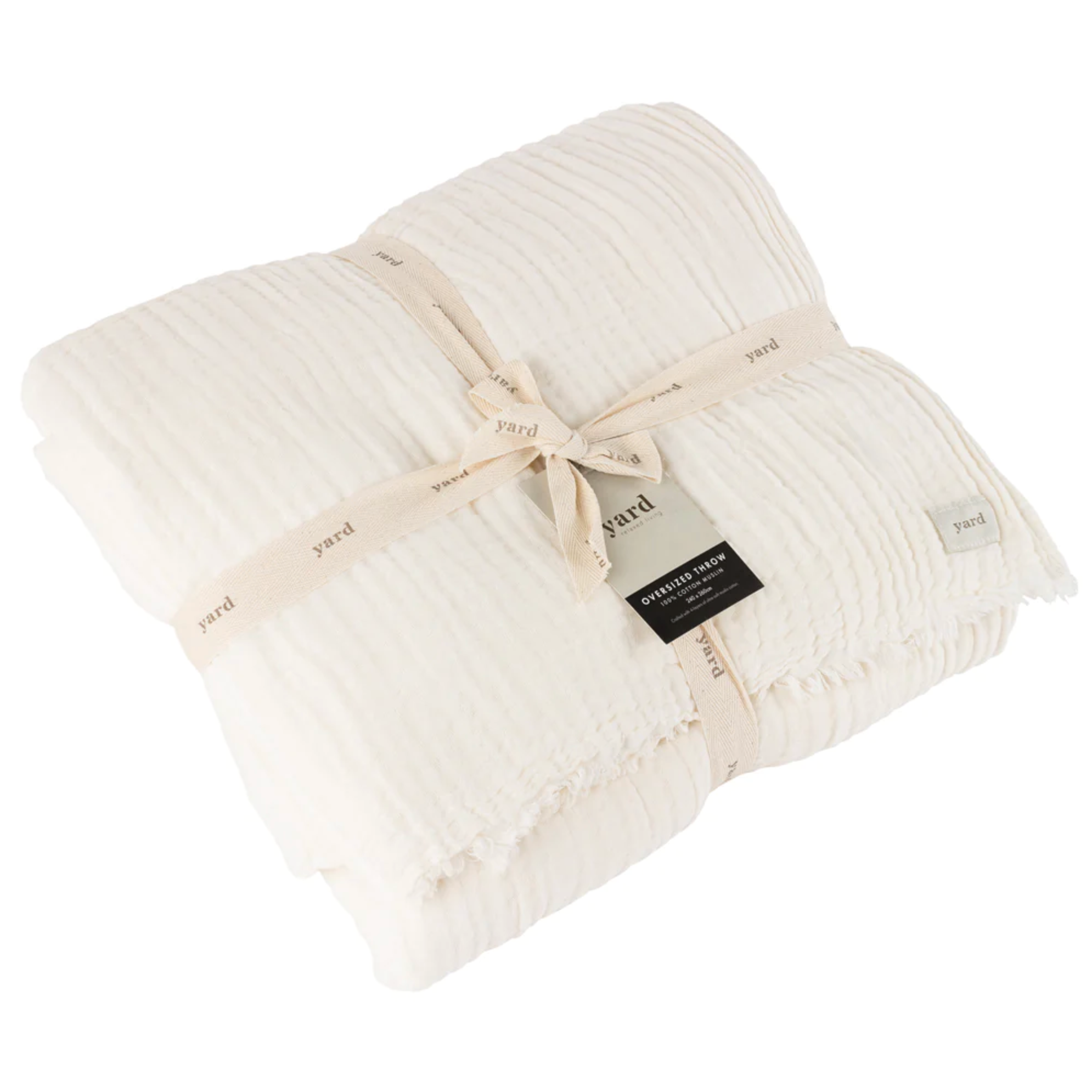 White Muslin Bedspread folded and tied with a cotton ribbon. 