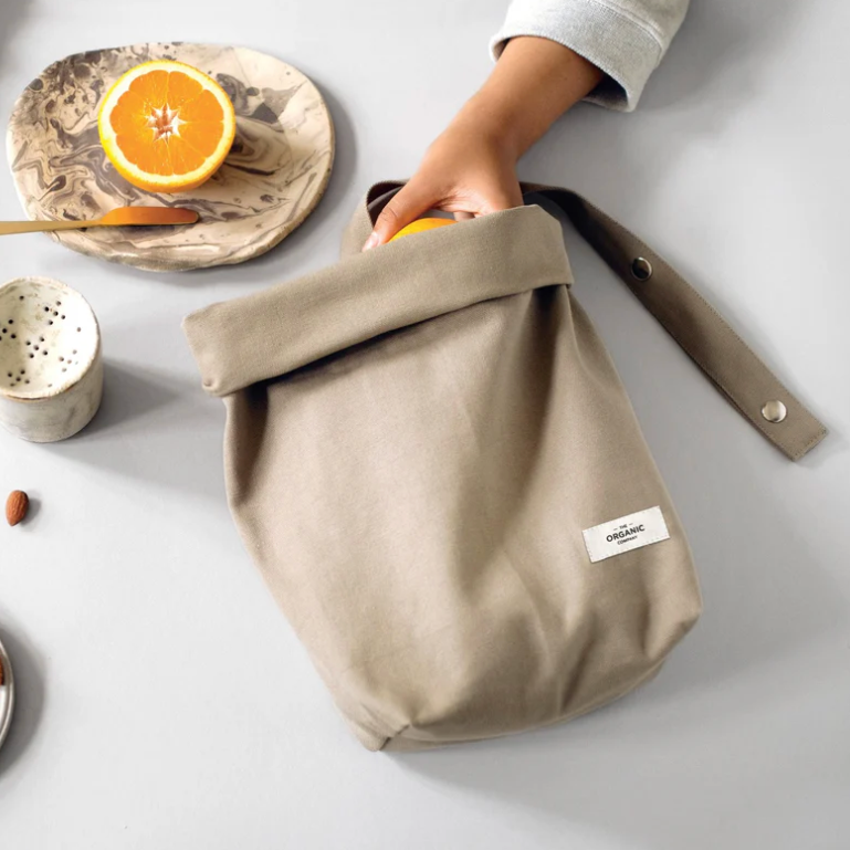 Organic stone cotton lunch bag rolled over with orange.