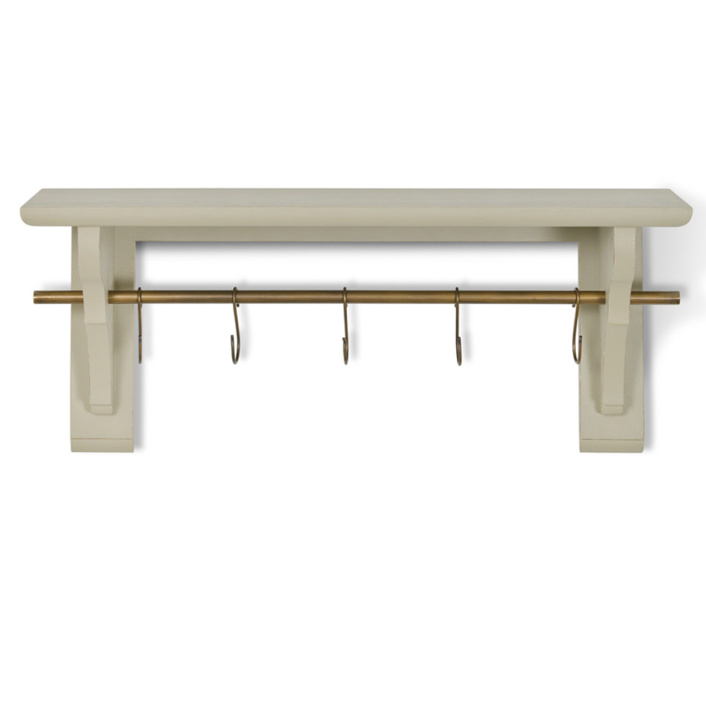 Clay coloured wooden shelf with brass shelf and hooks.