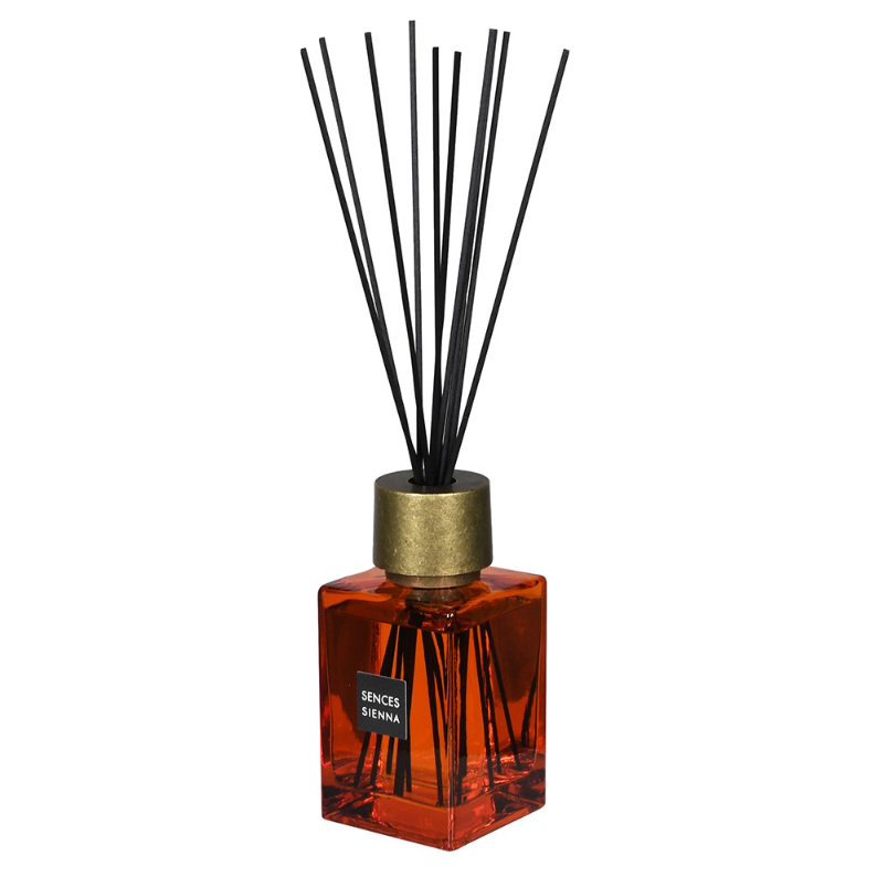 Sences Sienna Reed Diffuser in orange bottle against white background.