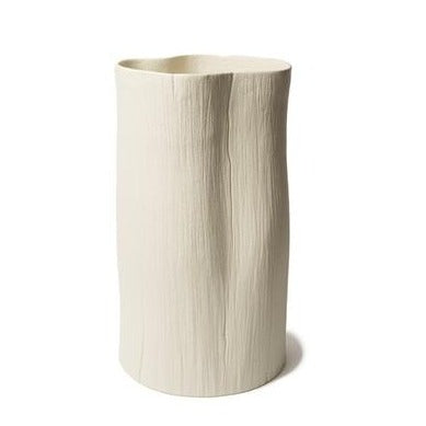 Stam cream white vase on wooden circle table.