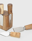 4 piece cheese knife set attached to wooden block.