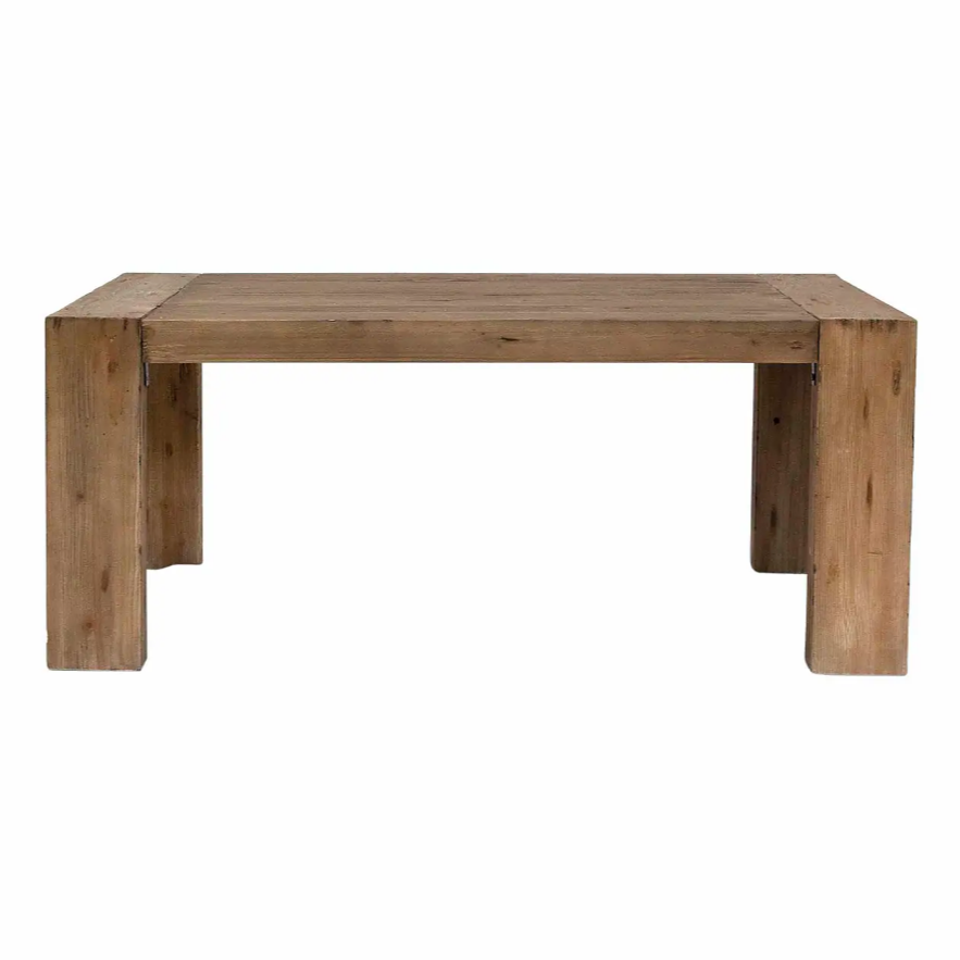 Solid chunky wood dining table on white background.