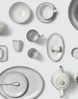 Off white speckle glazed dinnerware collection.