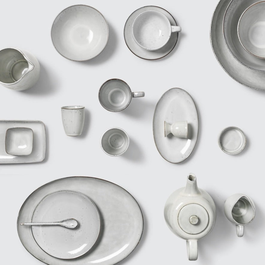 Off white speckle glazed dinnerware collection.