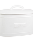 White ceramic bread bin with embossed lettering.