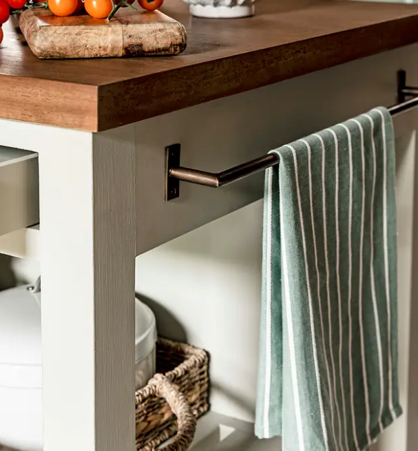 Close up of towel rail on wooden kitchen island.