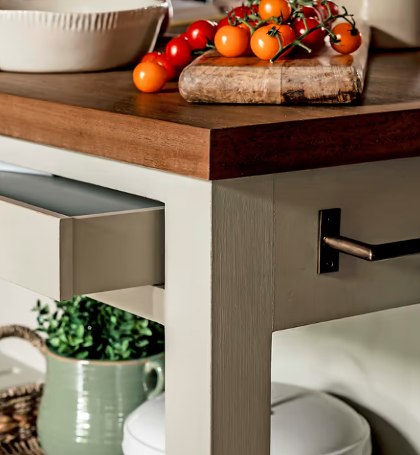 Close up of wooden kitchen island painted clay.