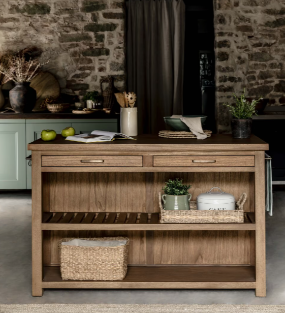 Wooden kitchen island with accessories and utentsils.