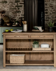 Wooden kitchen island with accessories and utentsils.