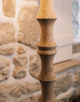 Detailed shot of Bamboo look wooden floor against stone wall.