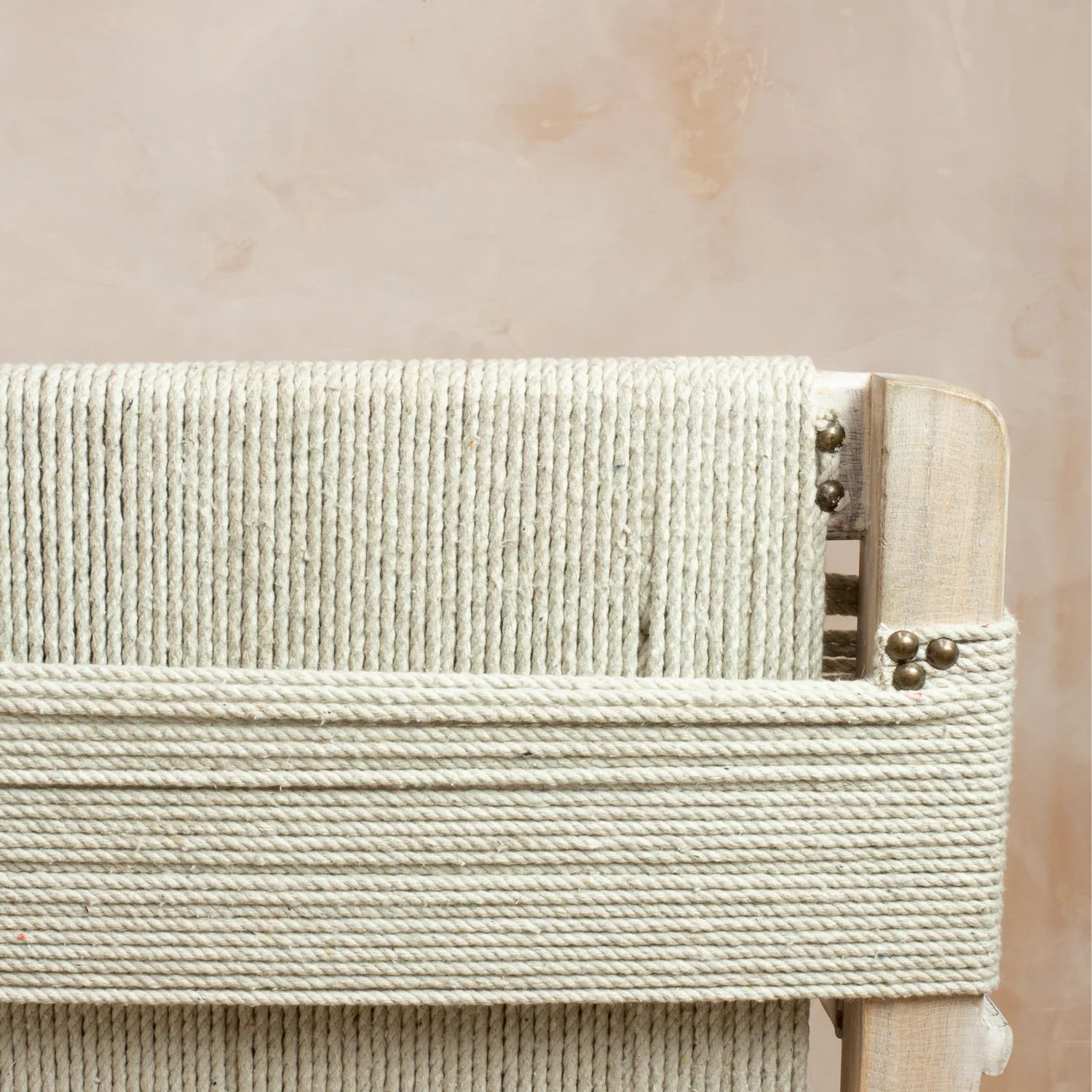The string rope detailing  on the back of the Lulworth Rustic Wooden Armchair.
