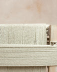 The string rope detailing  on the back of the Lulworth Rustic Wooden Armchair.