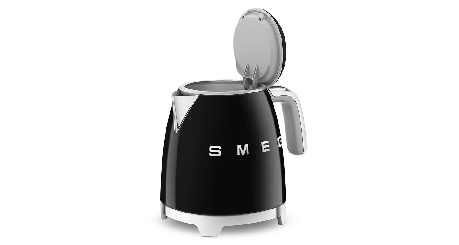 Mini cordless black smeg kettle with lid open.