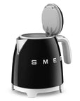 Mini cordless black smeg kettle with lid open.